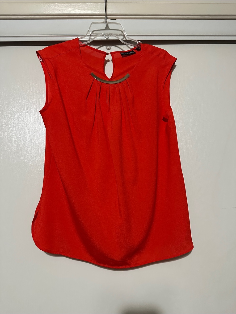 Red Sleeveless Blouse with Curved Accent Bar